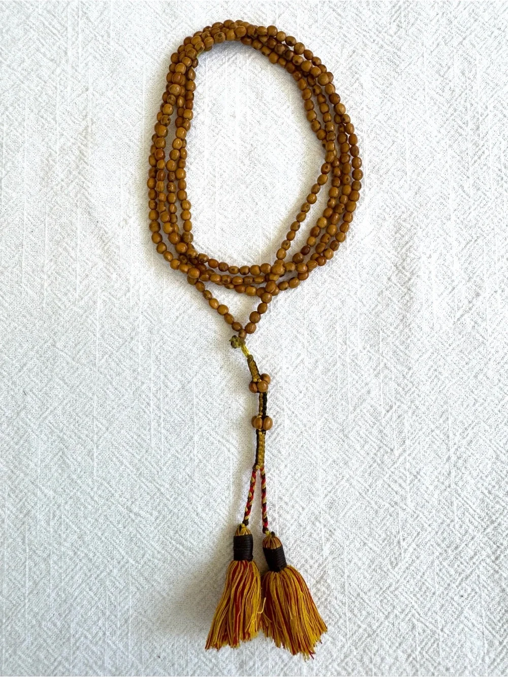 Meditation Beads: Knotted Chord with Small Beaded Sections and Tassels.